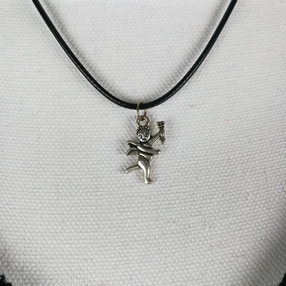 Jewelry - Silver tone Cupid pendant on black cord necklace